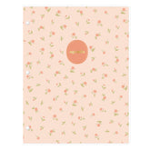 A three-ring hole punched 24 month non-dated notebook with a light peach-pink cover decorated with a small green and orange floral pattern. A circular rose-pink label in the center features the name &