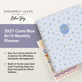 A 2027 Cami Blue 8x10 Monthly Planner by Sincerely Jules for Blue Sky, shown open with a light blue floral cover, spiral binding, and decorative sticker strips on a cream background with promotional text.