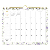 A spiral-bound monthly calendar page for January 2027, featuring a white background with light purple floral borders and gold accents, including a gold spiral binding and a gold clip at the top.