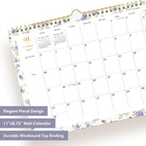 A spiral-bound monthly calendar page for January 2027, featuring a white background with light purple floral borders and gold accents, including a gold spiral binding and a gold clip at the top.