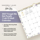 A spiral-bound monthly calendar page for January 2027, featuring a white background with light purple floral borders and gold accents, including a gold spiral binding and a gold clip at the top.