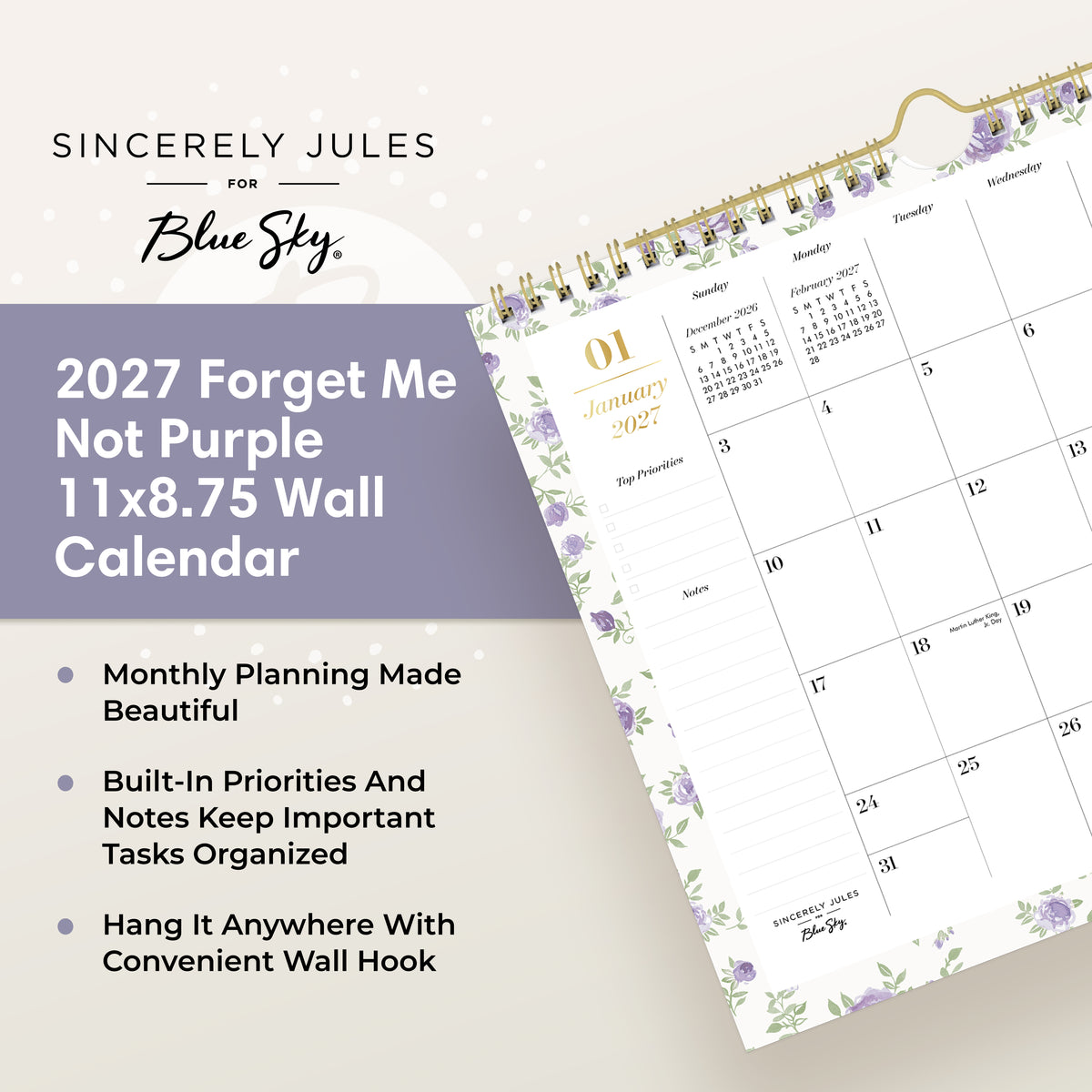 A spiral-bound monthly calendar page for January 2027, featuring a white background with light purple floral borders and gold accents, including a gold spiral binding and a gold clip at the top.