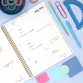 Planner with floral design on a light blue background for 2026-2027 academic school year.