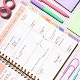 2026-2027 weekly spread featuring ample writing space, bullet points, to do-list and multi colored monthly tabs