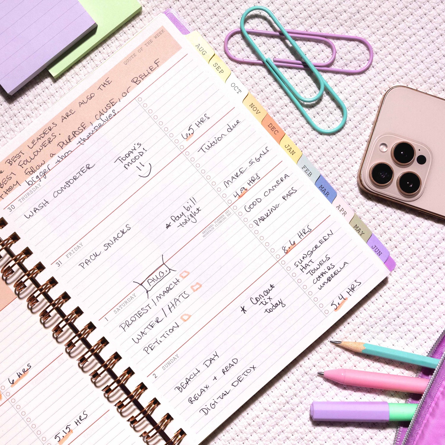 2026-2027 weekly spread featuring ample writing space, bullet points, to do-list and multi colored monthly tabs