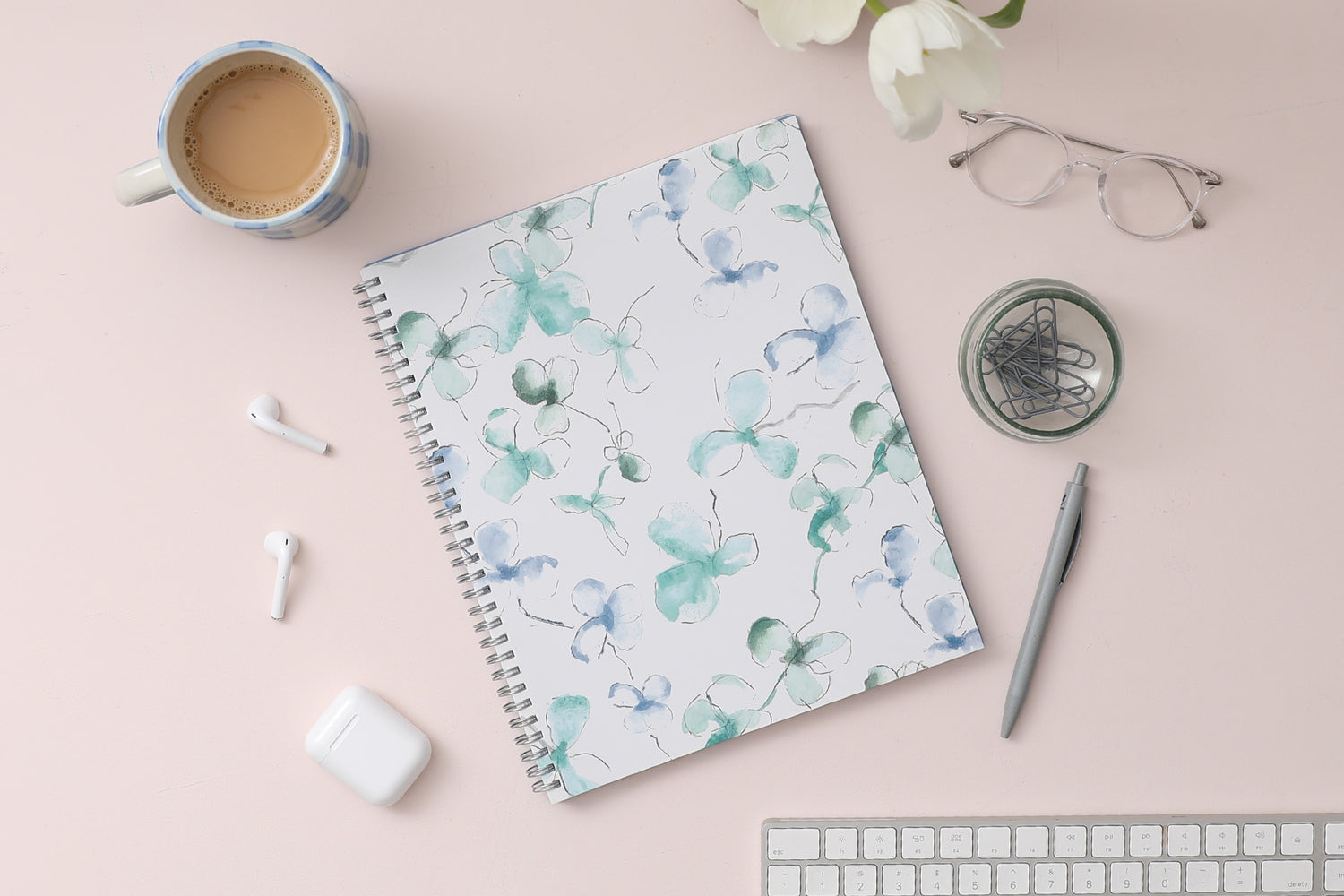 January 2024 to December 2024 weekly and monthly planner from Blue Sky featuring a floral pattern in hues of blue with twin silver wire-o binding and compact 8.5x11 size