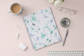 January 2024 to December 2024 weekly and monthly planner from Blue Sky featuring a floral pattern in hues of blue with twin silver wire-o binding and compact 8.5x11 size