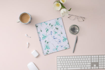 Plan way with this January 2024 - December 2024 monthly planner featuring a floral pattern front cover and twin silver wire-o binding