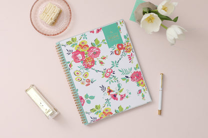 This January 2024 to December 2024 weekly monthly 5x8 planner featuring yellow and pink floral front cover pattern and gold twin wire-o binding