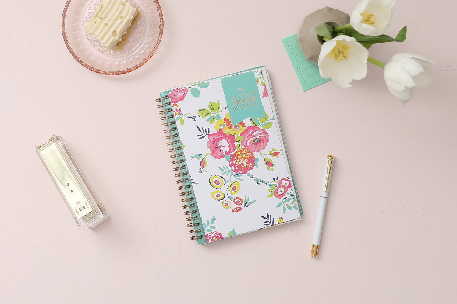 This January 2024 to December 2024 weekly monthly 5x8 planner featuring yellow and pink floral front cover pattern and gold twin wire-o binding