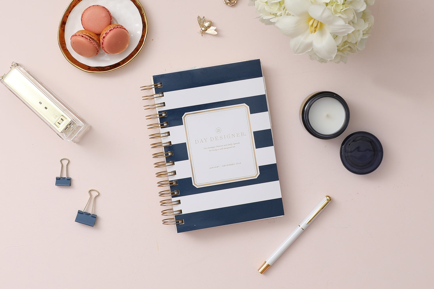 2024 daily monthly from day designer for blue sky featuring a hardcover, navy blue and white stripe design, gold twin wire-o binding in a compact 5x8 planner size.