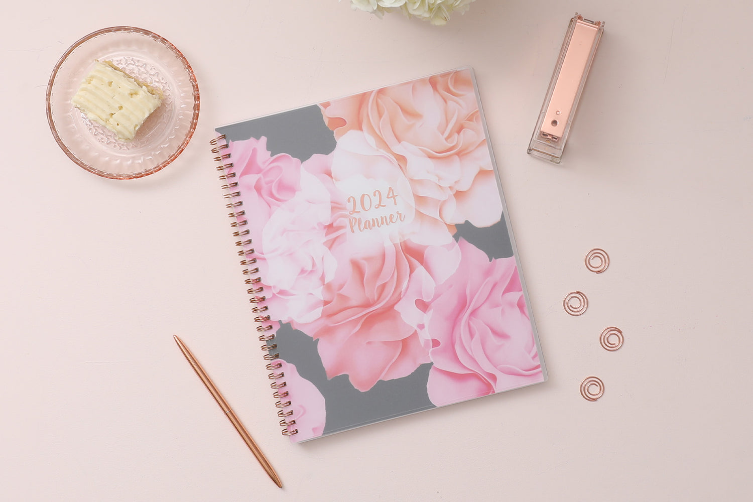 Take planning to the next level with this 2024 weekly monthly planner from Blue Sky featuring a cover with beautiful roses in shades of pink, rose gold twin wire-o binding in 8.5x11 planner size, and flexible front cover.