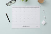 Experience this January 2024 - December 2024 clean geometric monthly wall calendar featuring reference months and ample lined writing space for each day