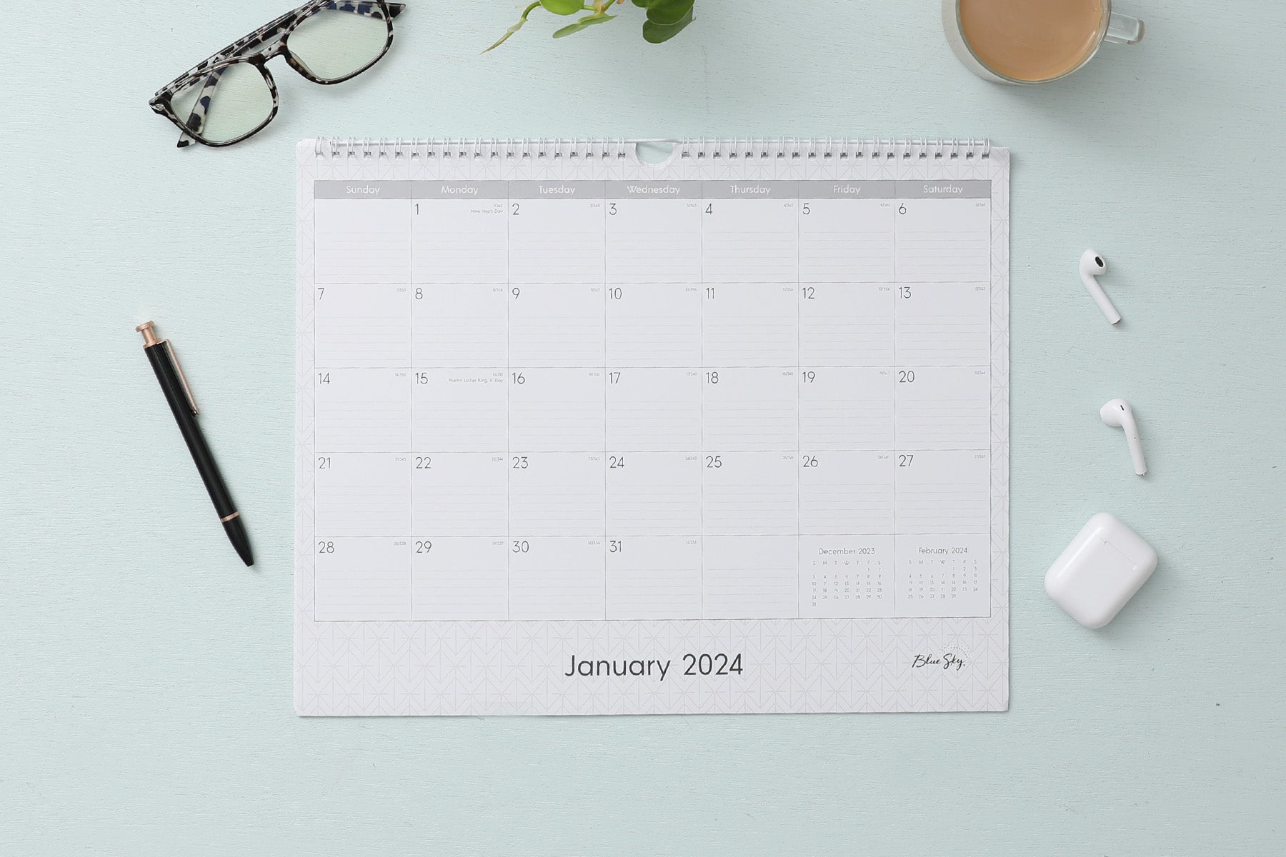 Experience this January 2024 - December 2024 clean geometric monthly wall calendar featuring reference months and ample lined writing space for each day