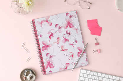 breast cancer awareness 2024 planner by blue sky featuring beautiful pink orchids and white background on the front cover in a 8.5x11 size