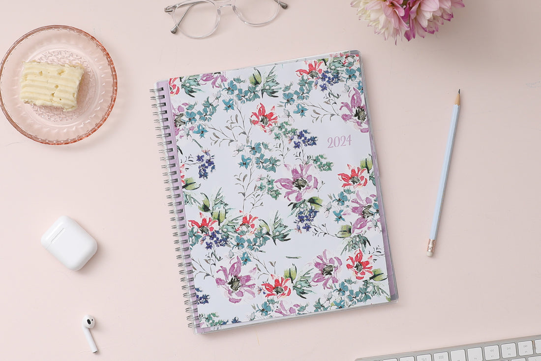 Blue Sky January 2024 - December 2024 weekly monthly planner featuring a floral front cover design with silver wire-o binding