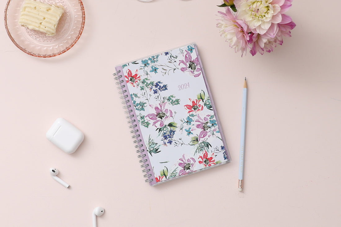 Blue Sky January 2024 - December 2024 weekly monthly planner featuring a floral front cover design with silver wire-o binding