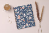 in partnership with one tree planted, the 2024 weekly monthly planner features a cute floral pattern and navy background cover.