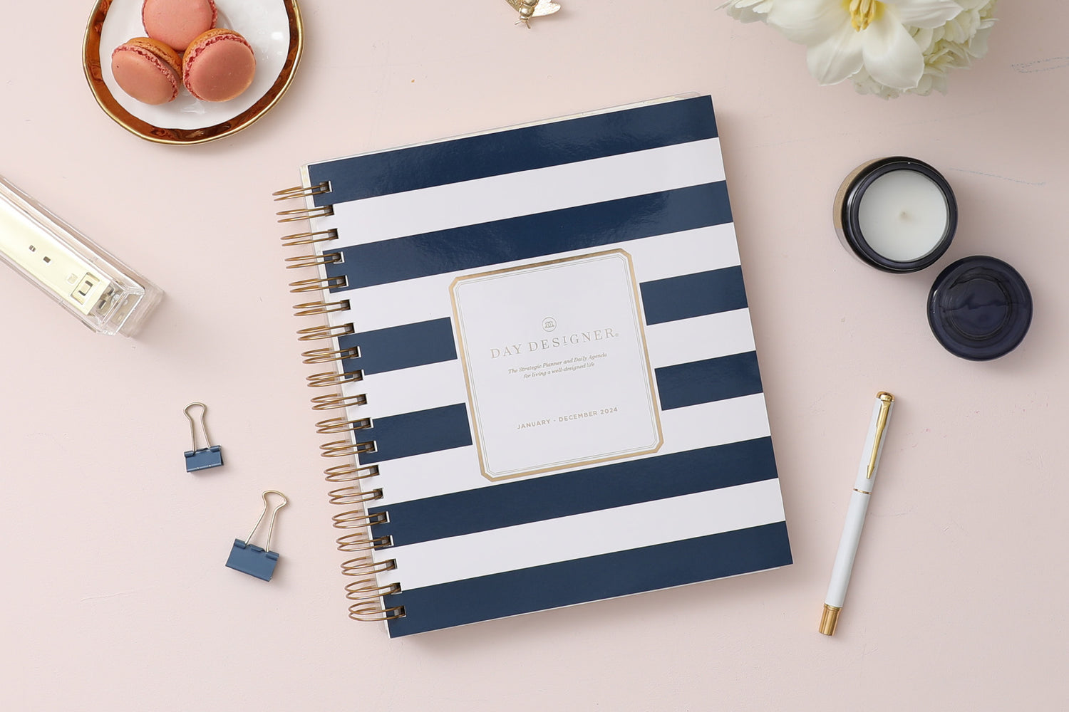 2024 daily monthly from day designer for blue sky featuring a hardcover, navy blue and white stripe design, gold twin wire-o binding in a compact 8x10 planner size.