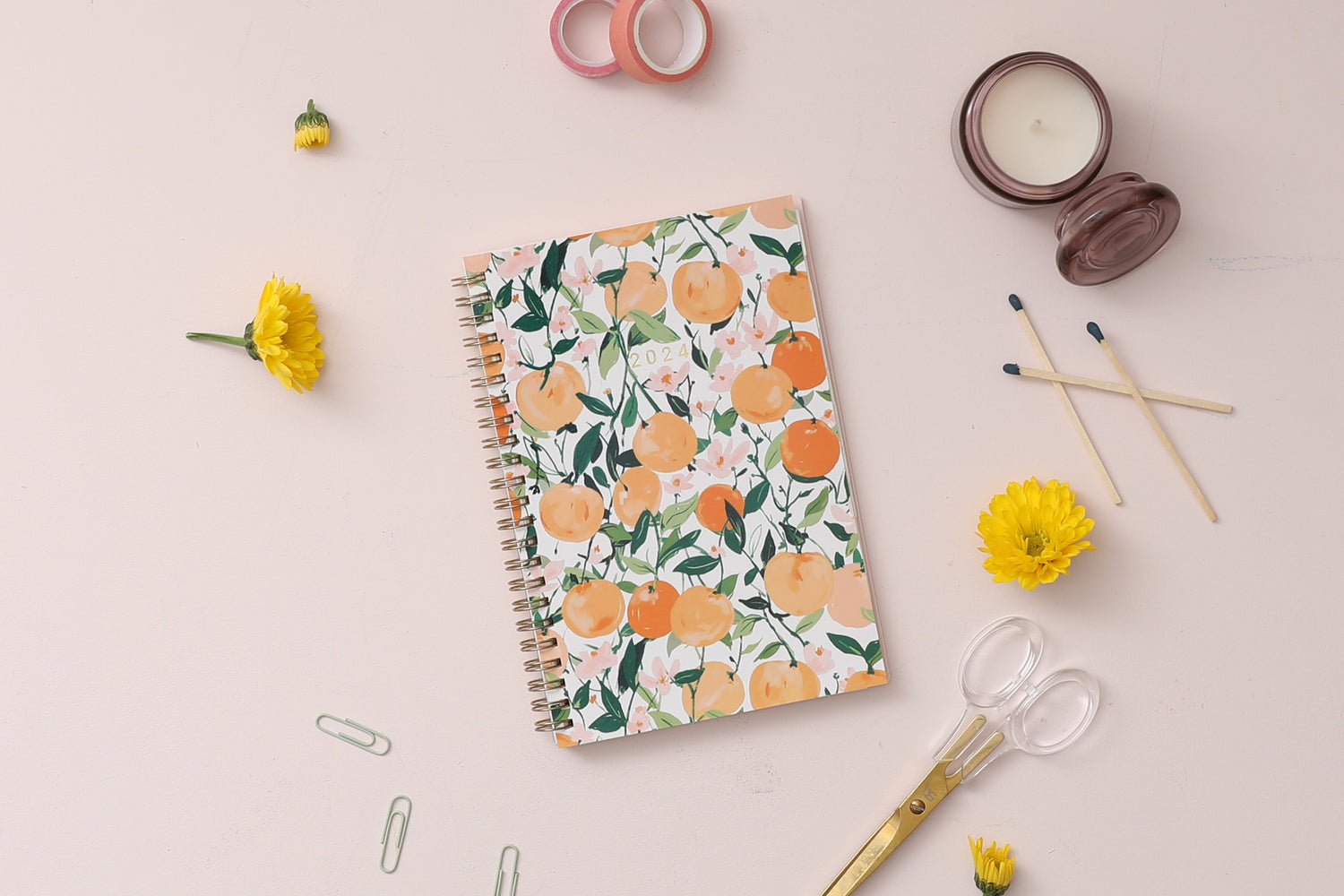 January 2024 - December 2024 weekly monthly planner featuring oranges and cuties on 5x8 planner size gold wire-o binding