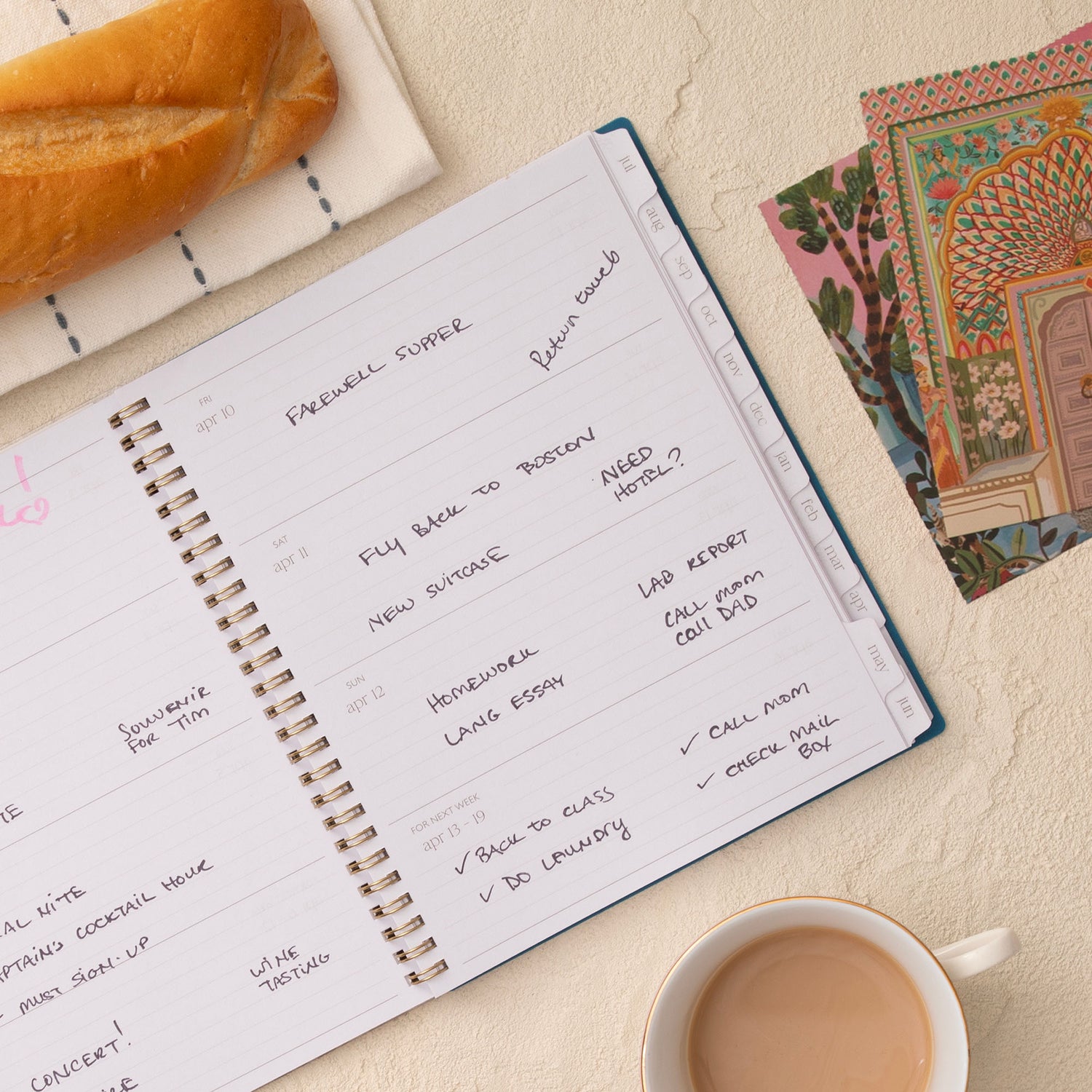 Open planner spread with lined writing space, white monthly tabs in 8.5x11 size