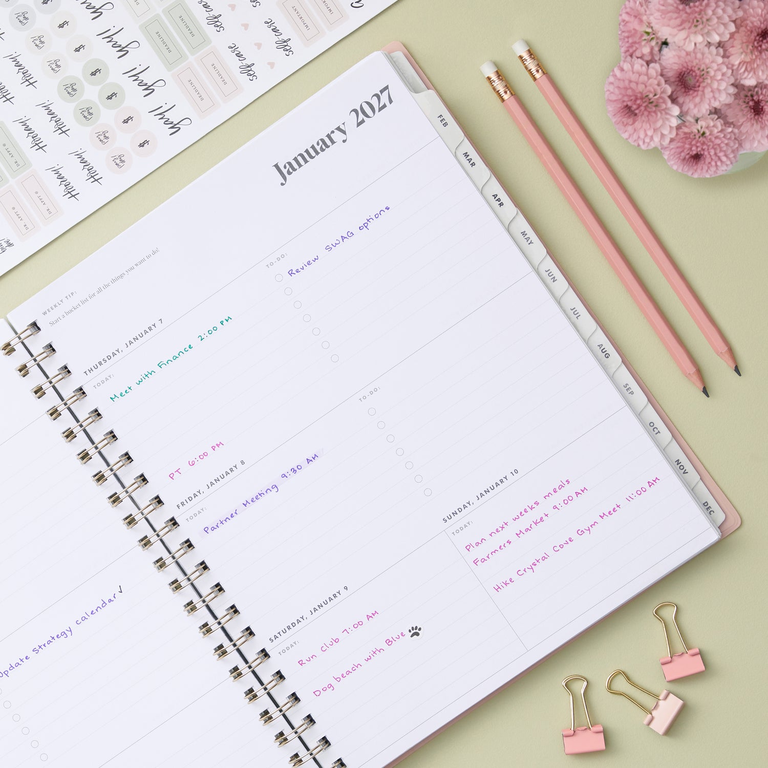 2027 weekly spread features ample lined writing space for to do lists, notes section, reference calendars, bullet points, and monthly tabs