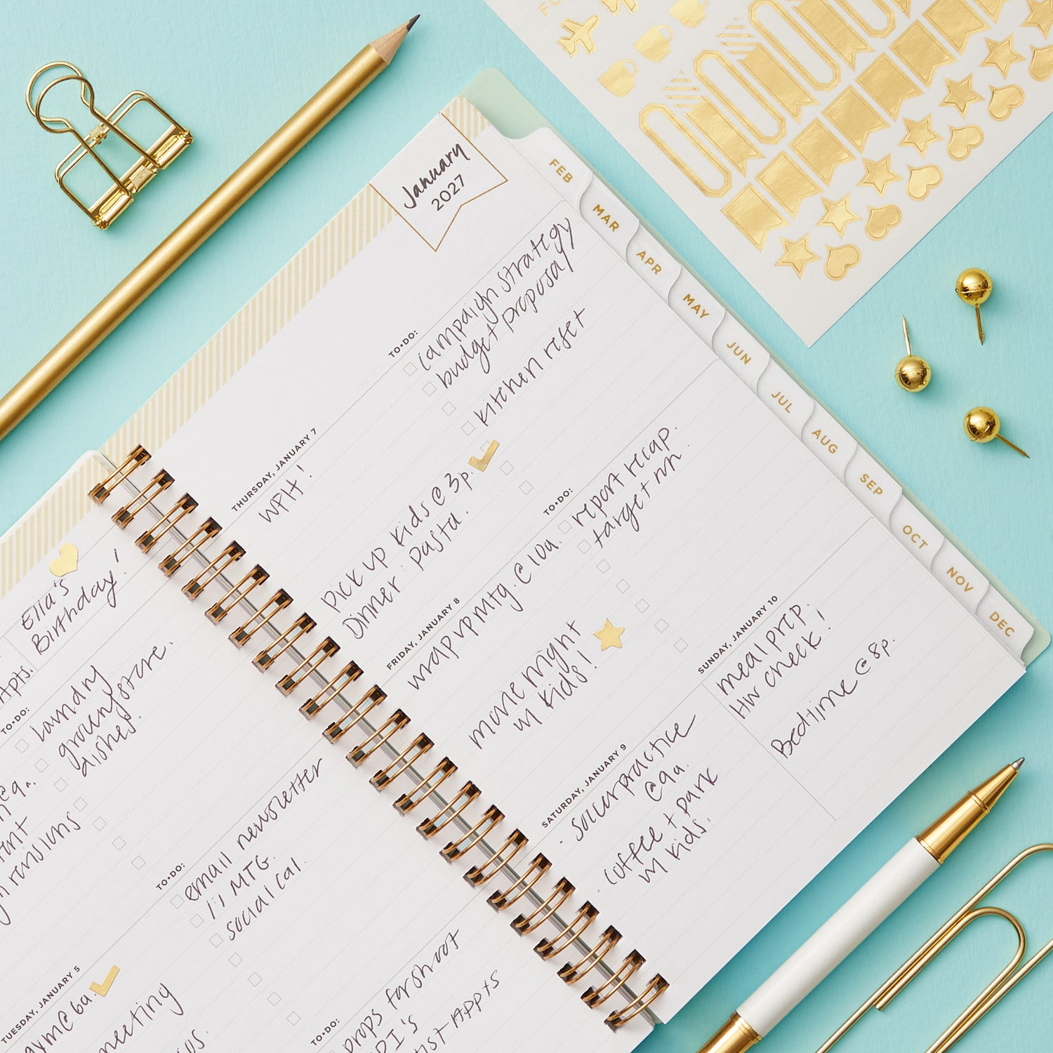 2027 weekly spread features ample lined writing space for to do lists, notes section, reference calendars, bullet points, and monthly tabs