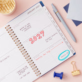 2027 weekly spread features ample lined writing space for to do lists, notes section, reference calendars, bullet points, and monthly tabs