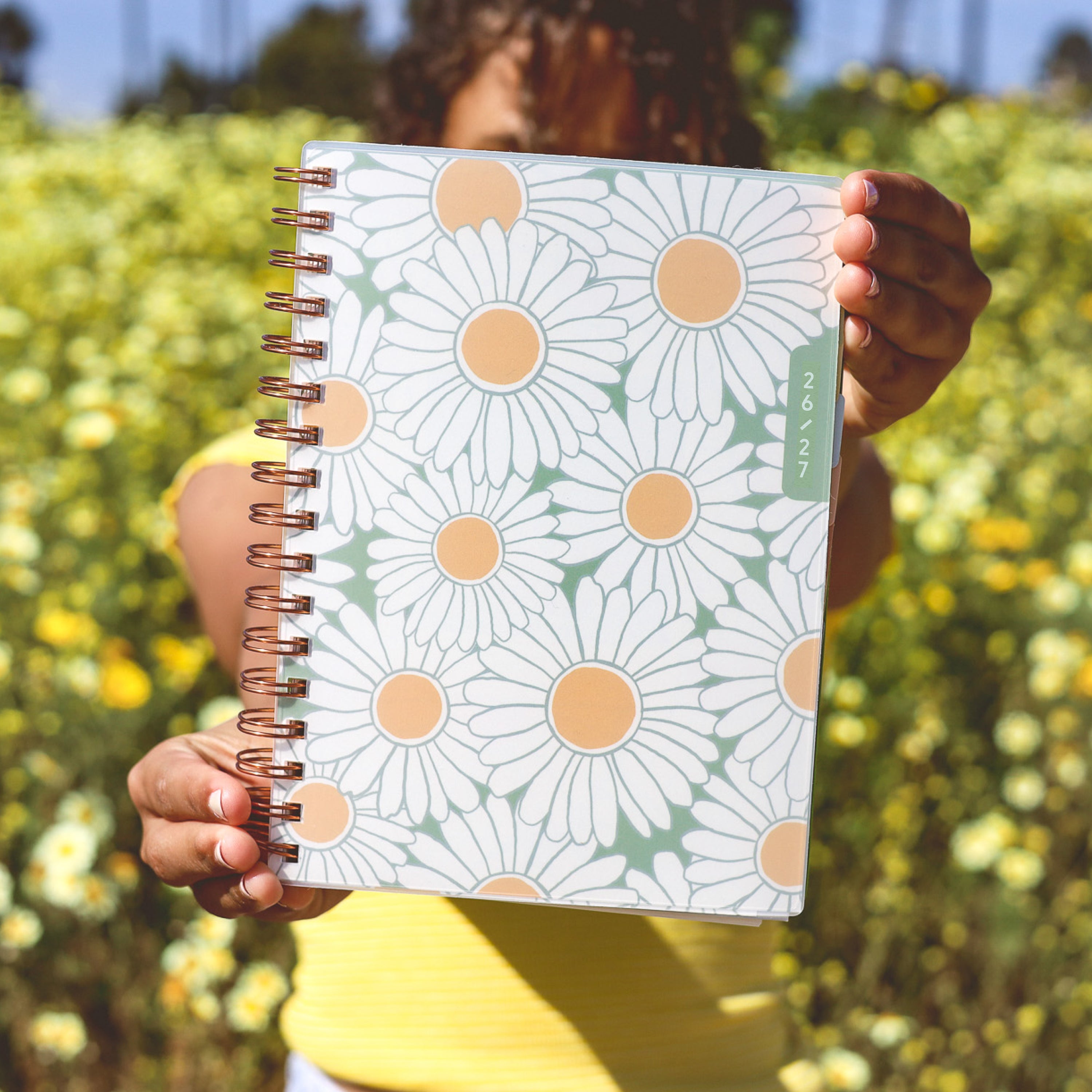 planner with daisy pattern on a white background
