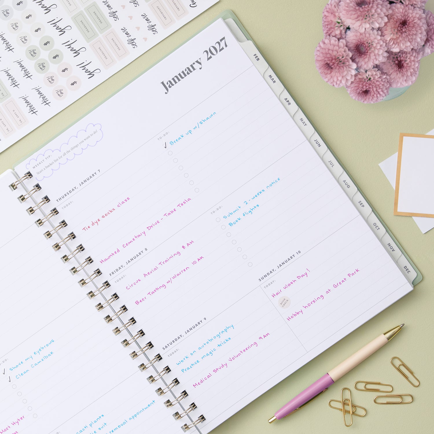 2027 weekly spread features ample lined writing space for to do lists, notes section, reference calendars, bullet points, and monthly tabs