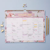 floral pattern bordering this 15x12 bl8ue sky 2027 planner with lined writing space for each day and reference calendars