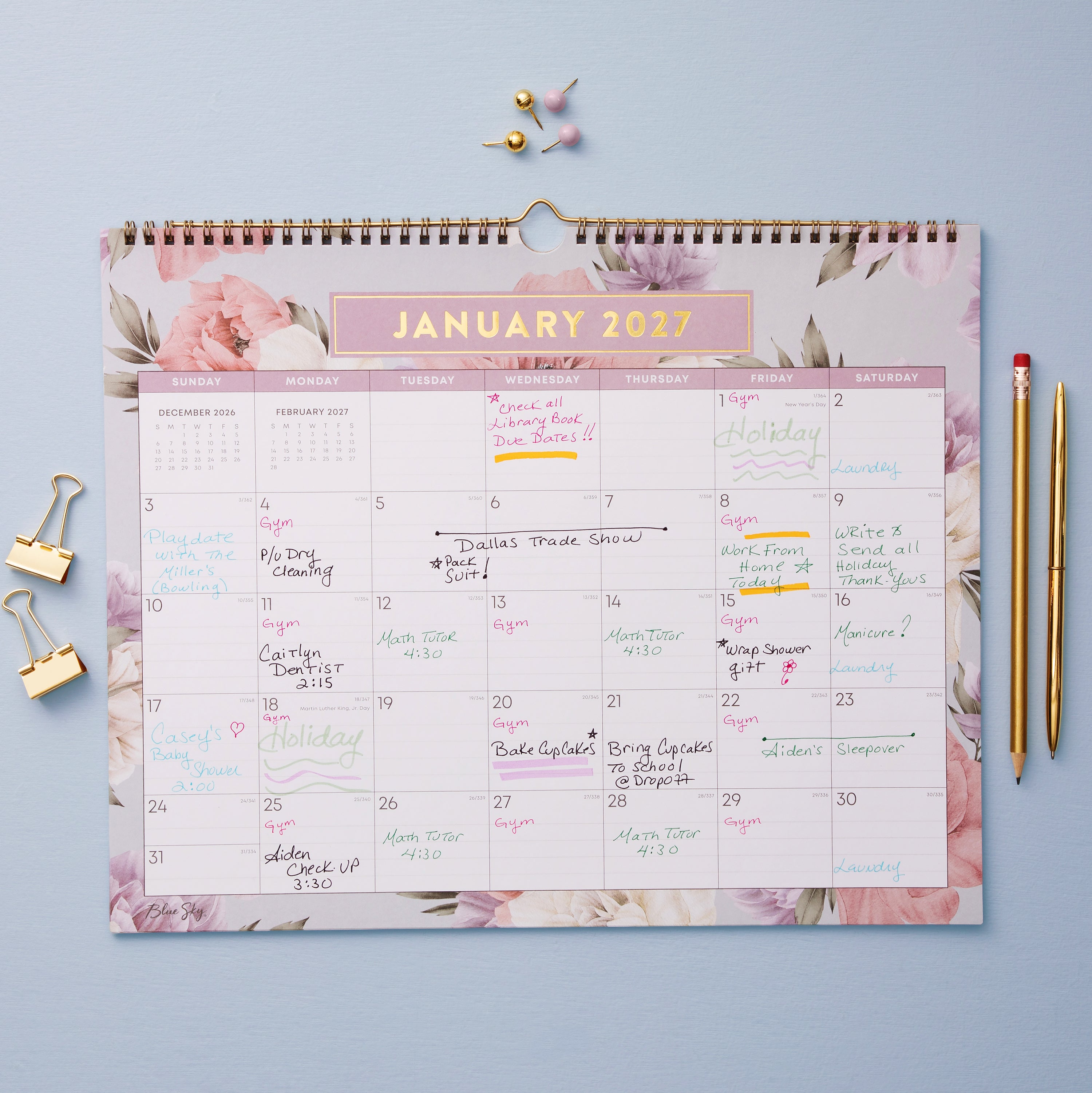 floral pattern bordering this 15x12 bl8ue sky 2027 planner with lined writing space for each day and reference calendars