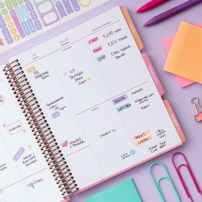 Weekly planner with new vertical layout and full spectrum color design, featuring dot grid and lined sections for notes with ample writing space 7x9 size