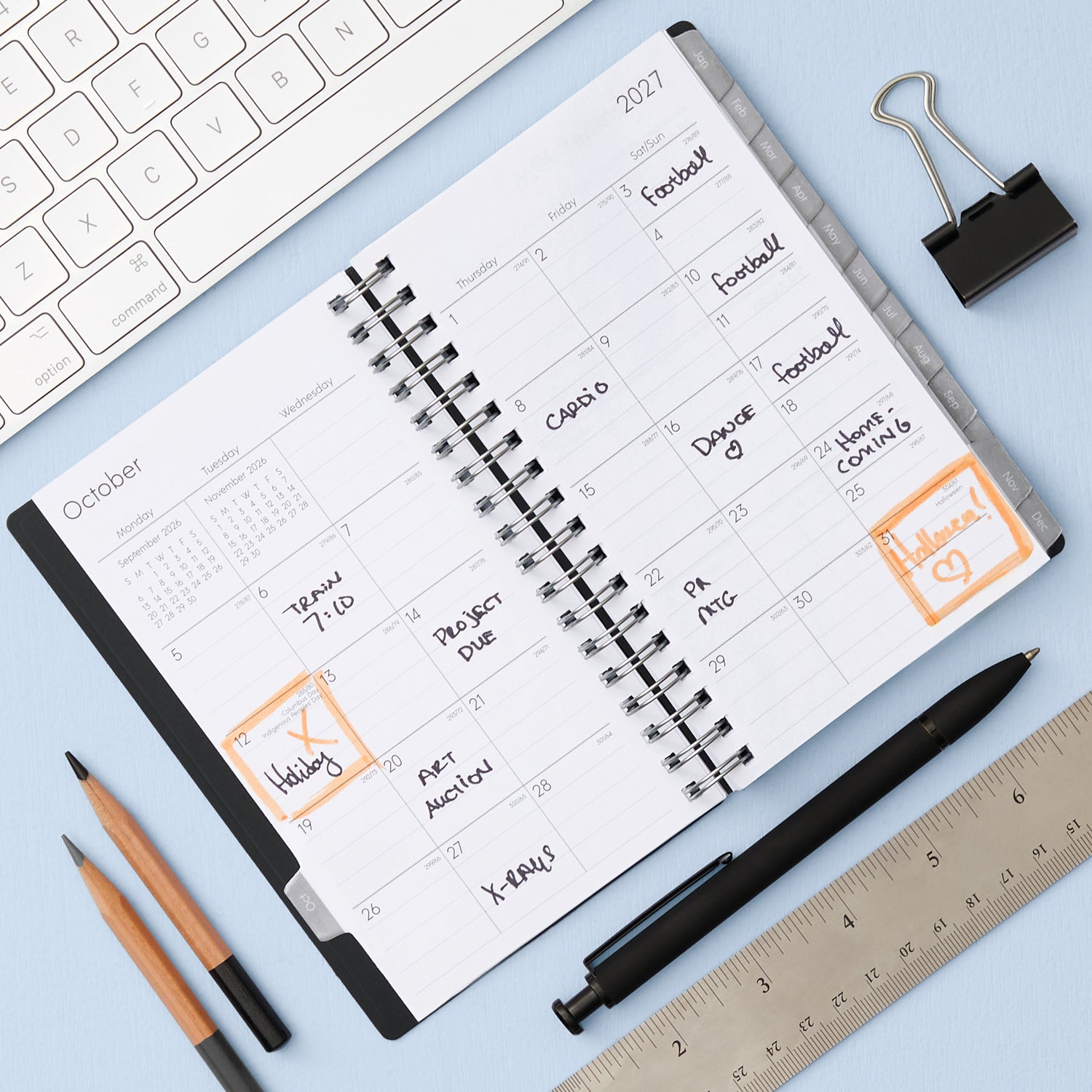 monthly layout featuring lined writing space, reference calendars, lined writing space and monthly tabs on this pocket sized planner