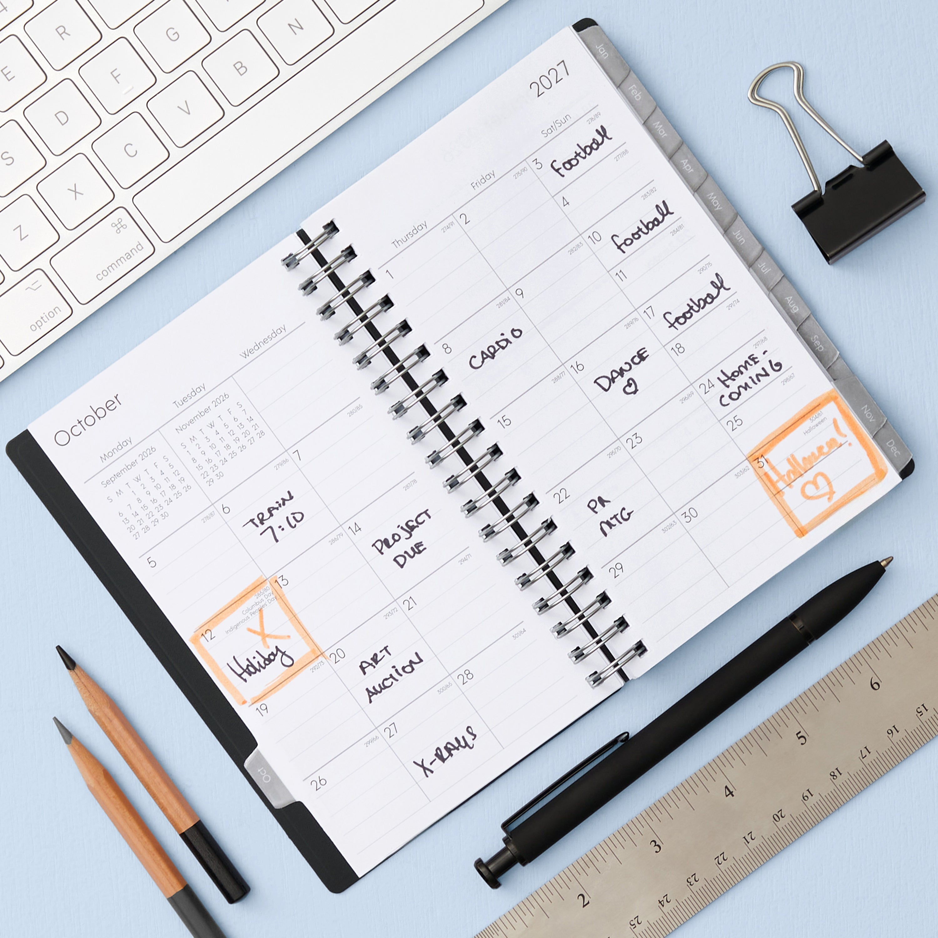 monthly layout featuring lined writing space, reference calendars, lined writing space and monthly tabs on this pocket sized planner