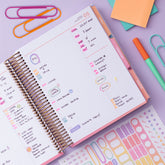 january 2027 to december 2027 daily monthly planner featuring daily spread with 1 hour increments, lined notes section, multi colored monthly tabs, and dot matrix for notes