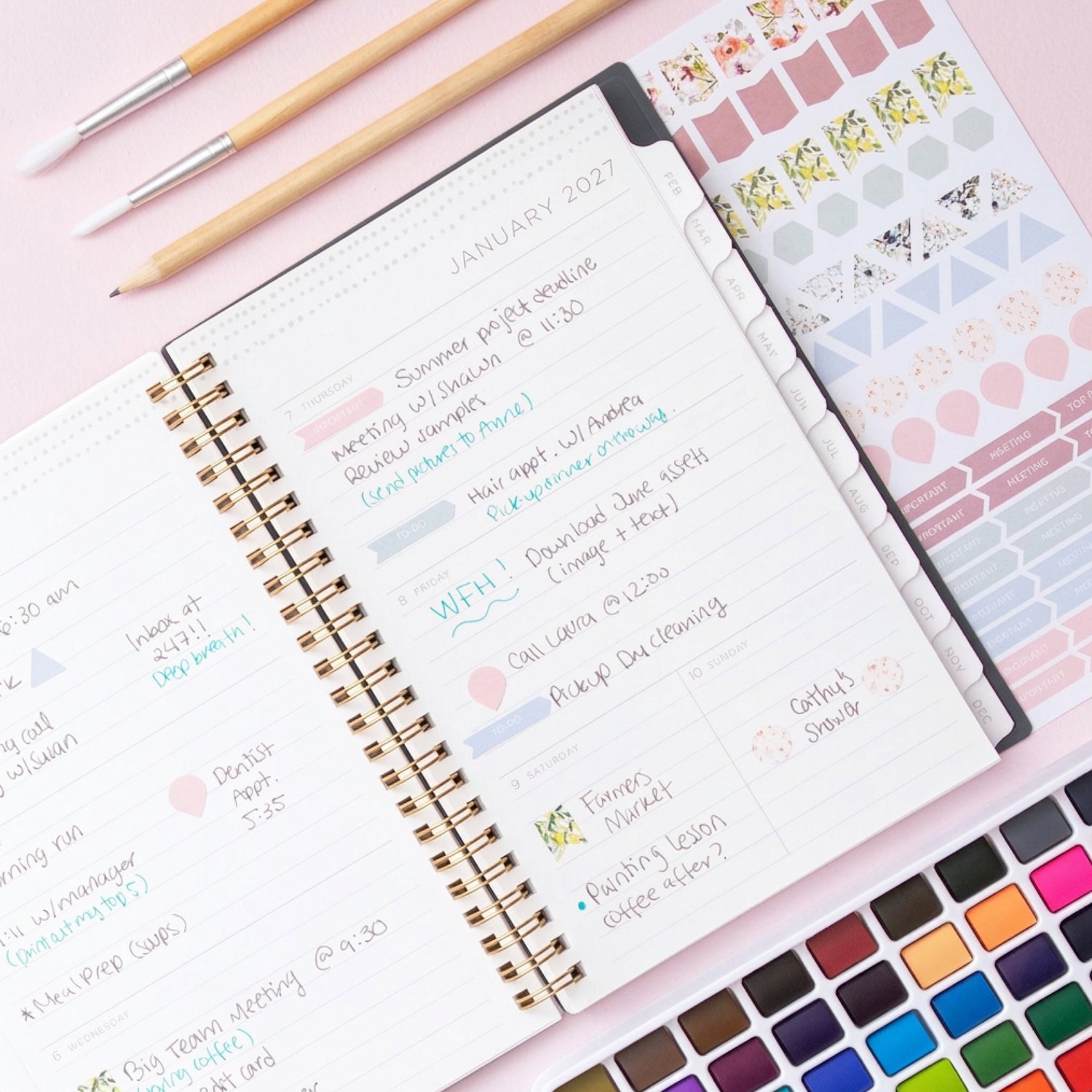 2027 weekly spread features ample lined writing space for to do lists, notes section, reference calendars, bullet points, and monthly tabs
