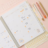 2027 monthly spread featuring ample lined writing space for each date, notes section, reference calendars, and monthly tabs