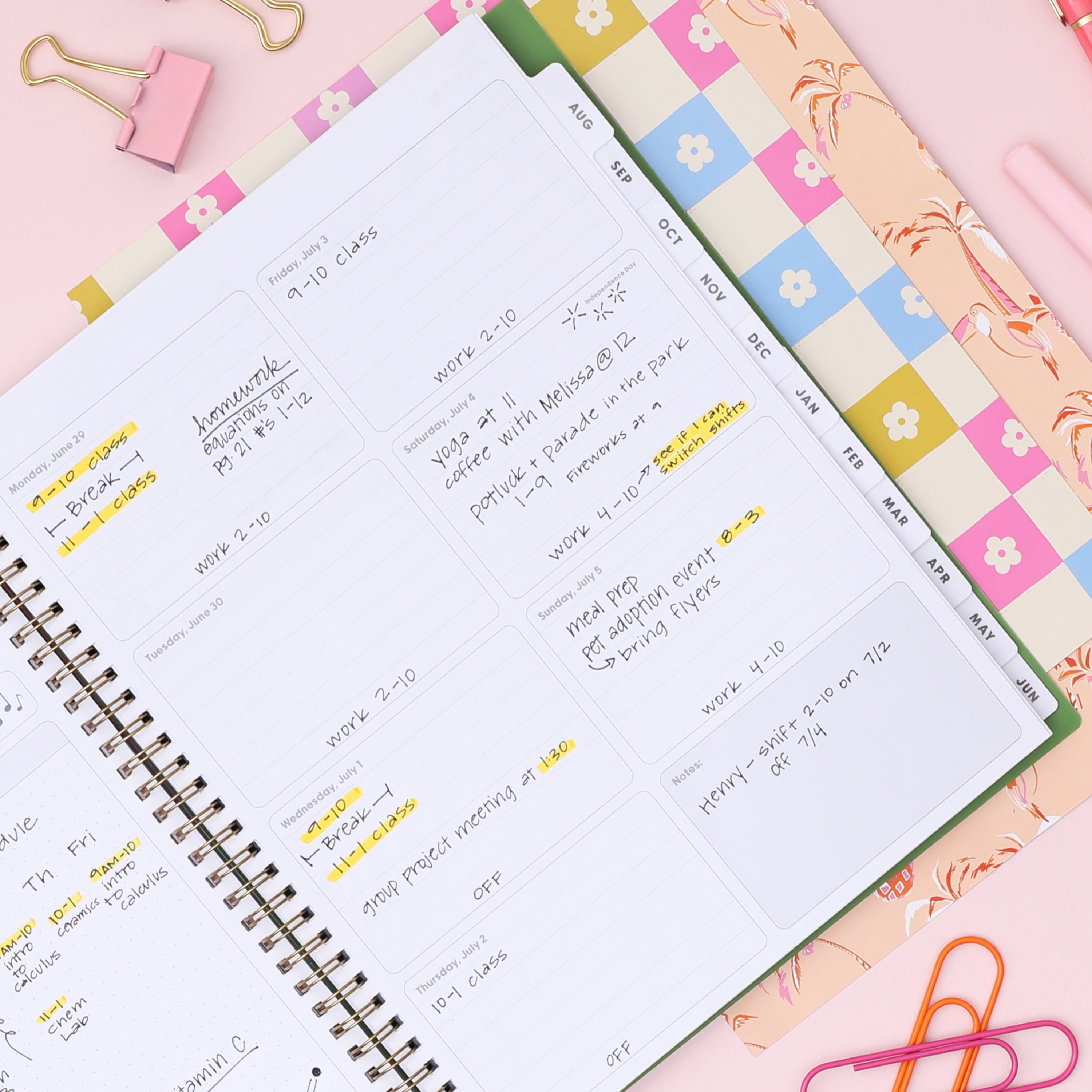 Green planner with white floral pattern and 2020/2027 label on a white background with weekly spread