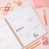 2027 weekly spread features ample lined writing space for to do lists, notes section, reference calendars, bullet points, and monthly tabs