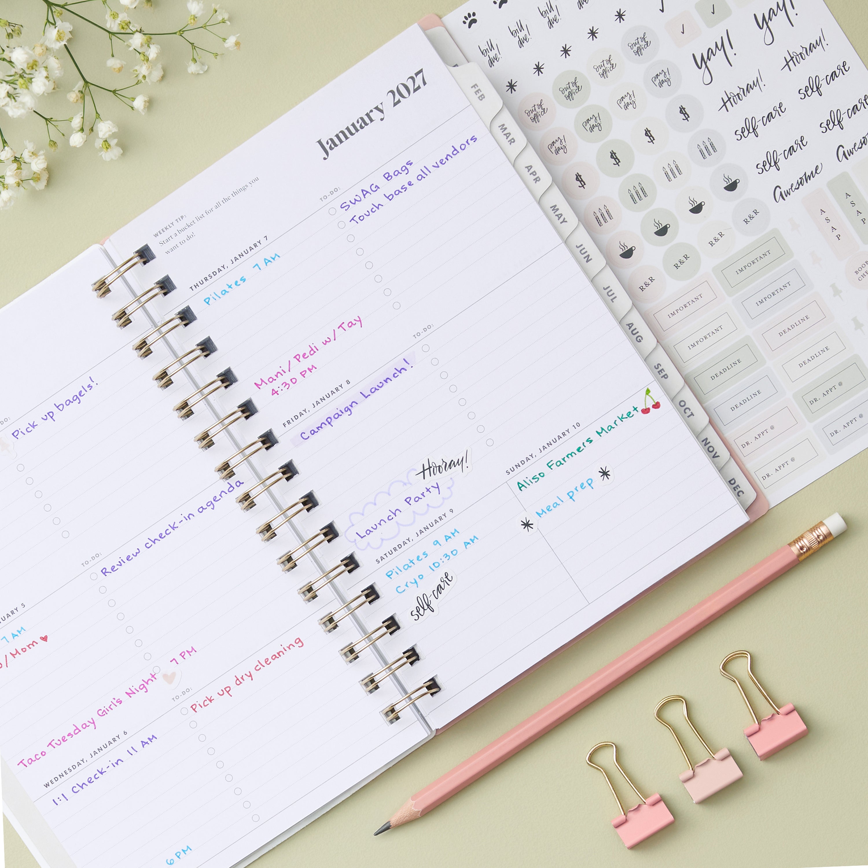 2027 weekly spread features ample lined writing space for to do lists, notes section, reference calendars, bullet points, and monthly tabs