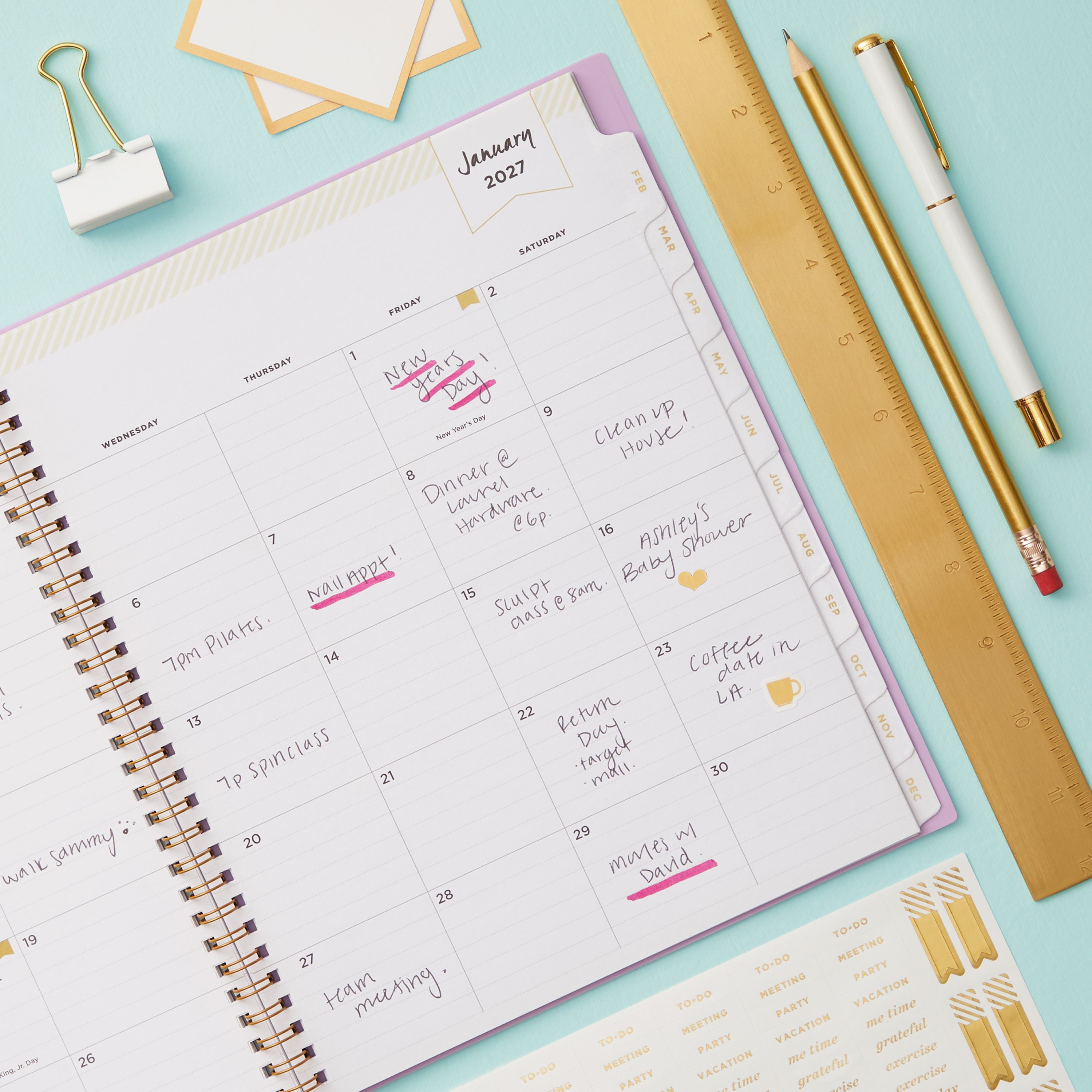 2027 monthly spread featuring ample lined writing space for each date, notes section, reference calendars, and monthly tabs