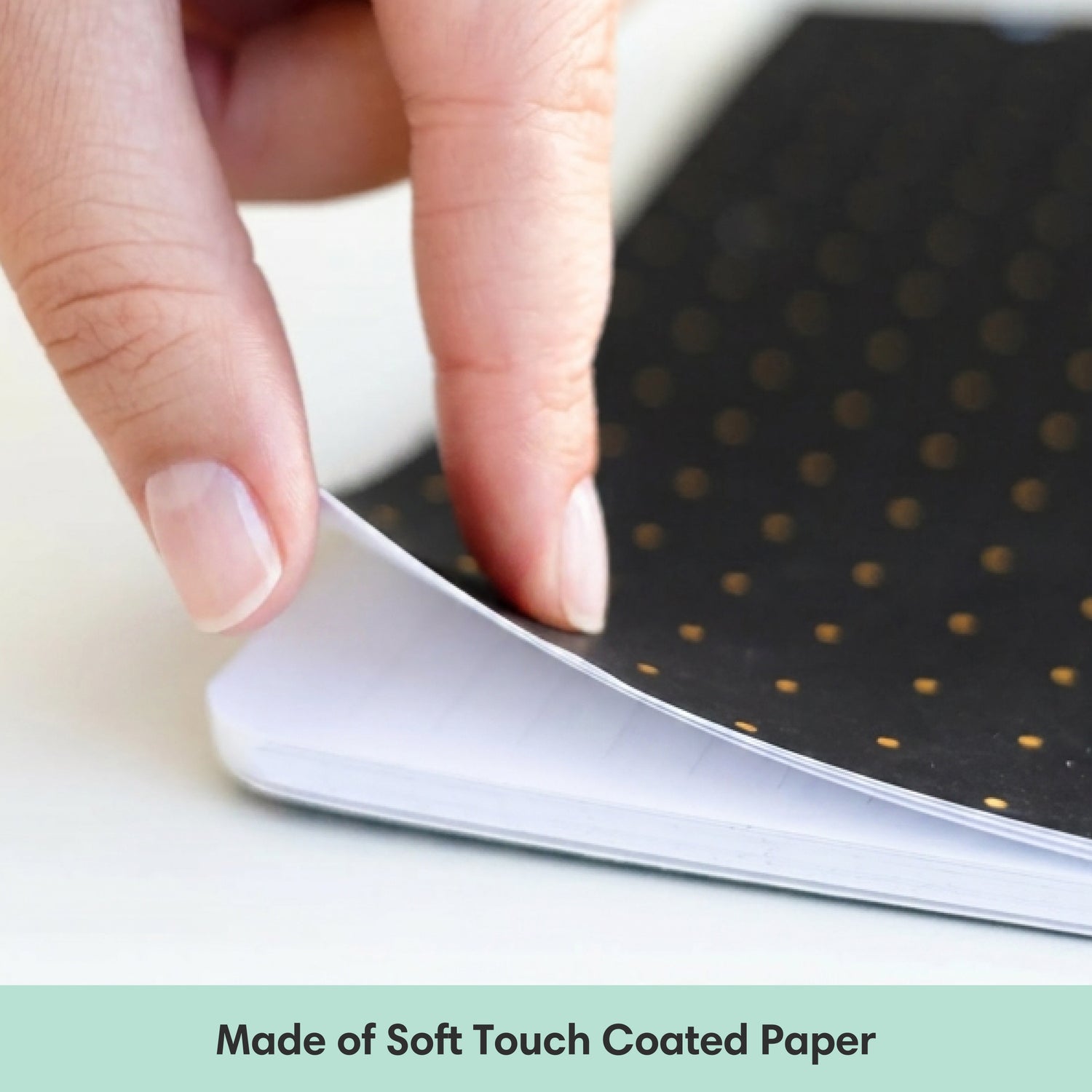 Hand holding a sheet of paper with a floral design, labeled &