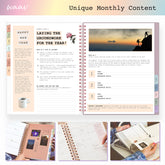 Open planner showing monthly content with a sunset silhouette on a mountain, surrounded by smaller images of the planner&