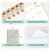 Calendar planner with features highlighted on a white background like gold twin wire o binding, laminated tabs, bonus months