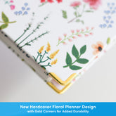 high definition photo of the planner printed with a solid, hard cover with gold corners.

