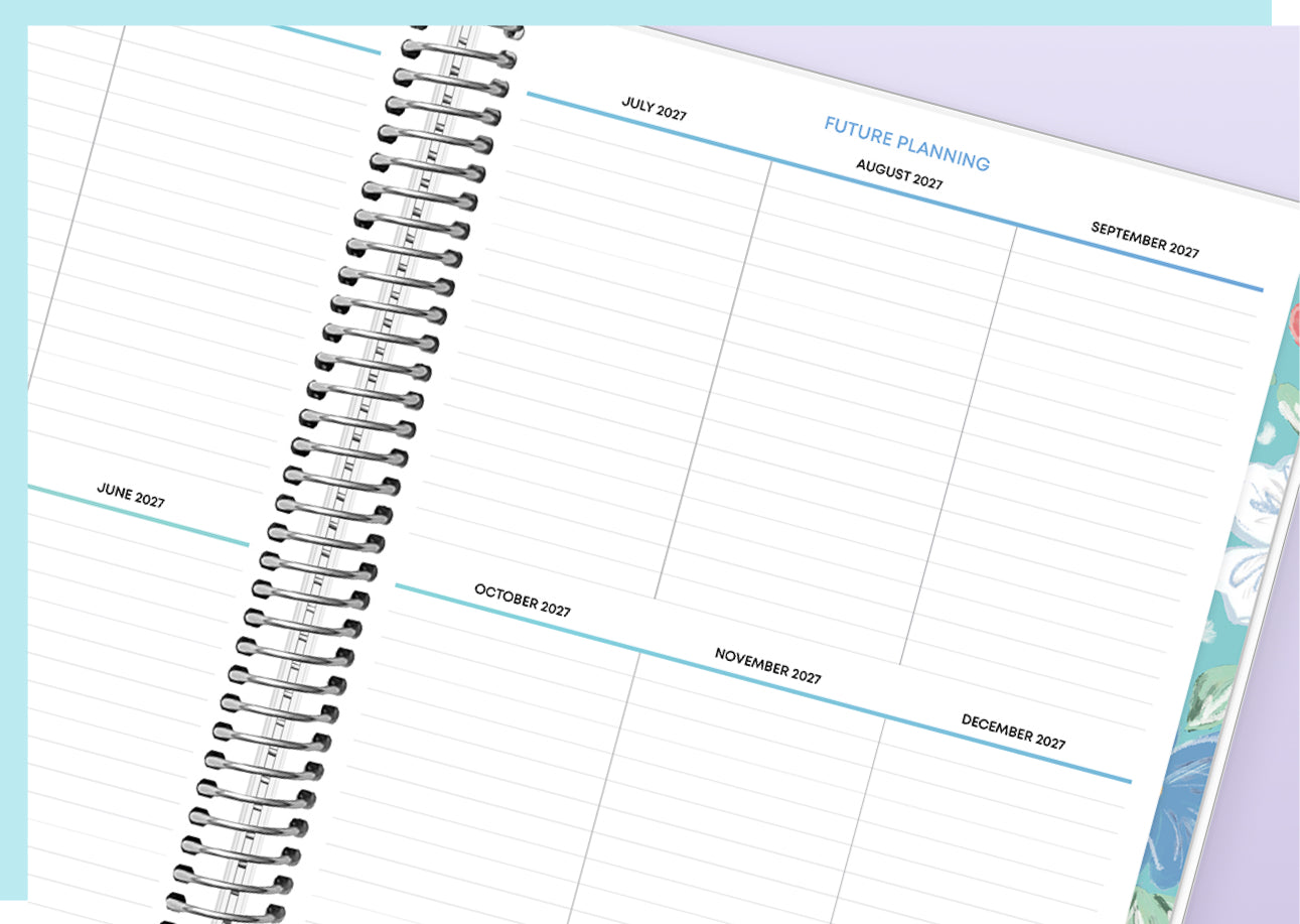Spiral-bound planner with monthly layout on a light purple background