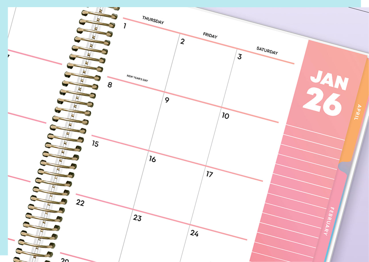 Calendar with a pink monthly view and gold spiral binding