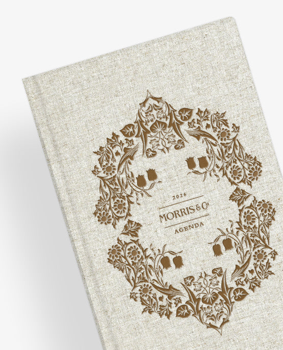 Beige planner with decorative floral design and 'Morris & Co' branding on a white background