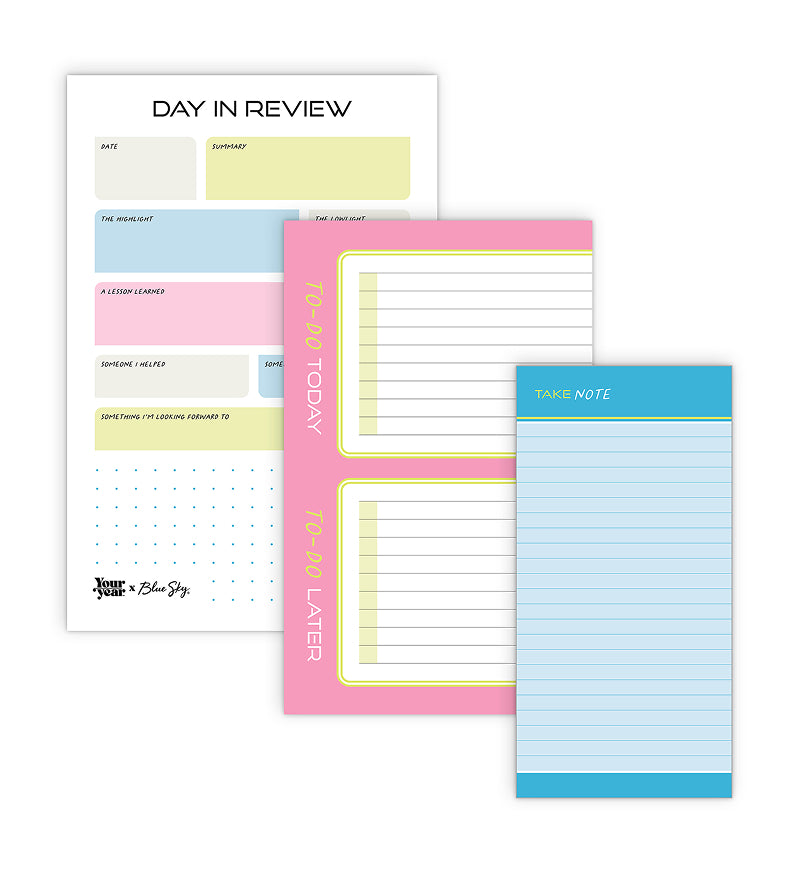 Set of colorful notepads with different designs on a white background